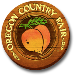 Oregon Country Fair text on a wooden sign with a peach in the middle